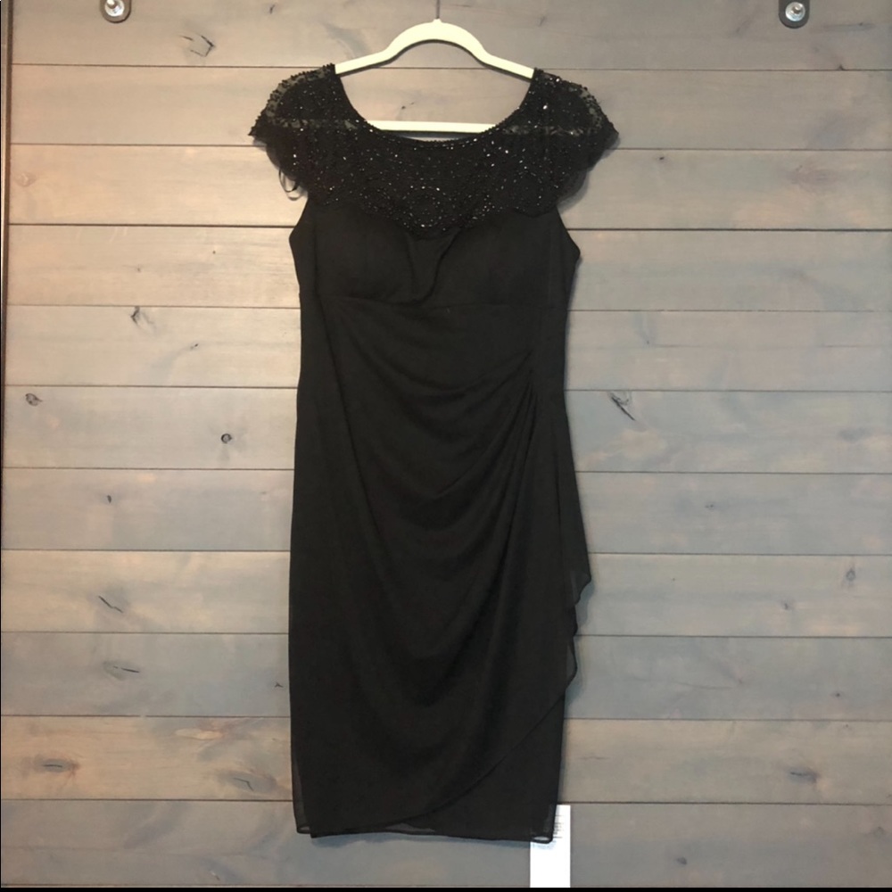 Cache mid length dress with beaded detail.